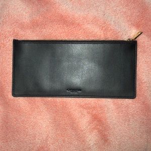 Black coach pouch.